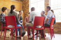 People talking in group therapy session — Stock Photo