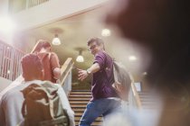 College students ascending stairway together — Stock Photo