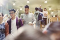 College students descending stairway together — Stock Photo