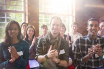 Portrait of clapping audience at community center — Stock Photo