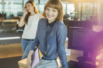 Businesswoman smiling in office — Stock Photo