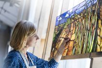 Stained glass artist finishing project — Stock Photo