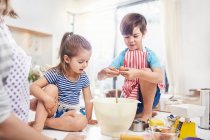 Boy and girl brother and sister baking on kitchen counter — Stock Photo