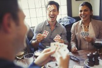 Friends playing Blind Man Bluff at bar — Stock Photo