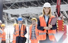 Portrait smiling female engineer at construction site — Stock Photo
