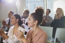 Businesswomen clapping in conference audience — Stock Photo