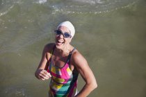 Overhead view of smiling Female active swimmer at ocean outdoors — Stock Photo