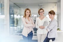 Portrait smiling businesswomen in modern office — Stock Photo