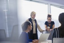 Businesswomen talking, working in conference room meeting — Stock Photo