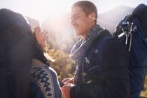 Young couple with backpacks hiking — Stock Photo