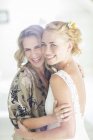 Portrait of bride and matron of honor at wedding reception — Stock Photo