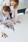 Female designers drawing sketch in conference room — Stock Photo