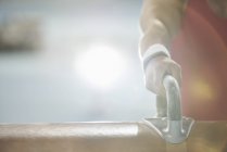 Close up hand of male gymnast on pommel horse — Stock Photo