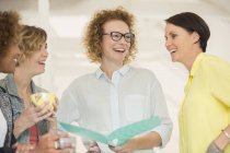 Portrait of laughing female office workers — Stock Photo