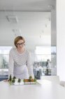 Portrait confident female architect with model in conference room — Stock Photo