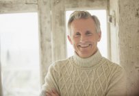Portrait smiling senior man in turtleneck sweater — Stock Photo