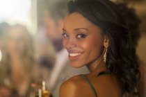 Portrait of young smiling woman at wedding reception — Stock Photo