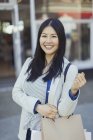 Portrait smiling young woman with shopping bags — Stock Photo