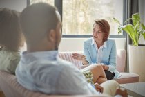Therapist talking to couple in couples therapy session — Stock Photo
