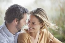Smiling affectionate couple face to face — Stock Photo
