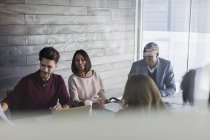 Smiling business people planning in conference room meeting — Stock Photo