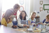 Female artists painting in art class workshop — Stock Photo