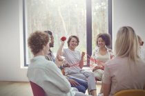 Group therapy session doing team building exercise with yarn — Stock Photo