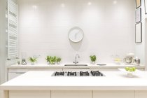 White, modern luxury home showcase interior kitchen with clock — Stock Photo