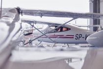 Small airplane in hangar — Stock Photo