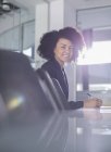 Portrait smiling businesswoman working in conference room — Stock Photo