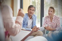 Couple listening to therapist in couples therapy counseling session — Stock Photo