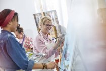 Female artists painting in art class studio — Stock Photo