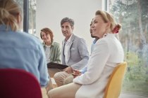 People listening in group therapy session — Stock Photo