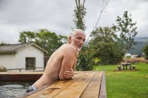 Mature man relaxing in hot tub — Stock Photo