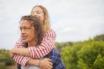 Affectionate couple hugging outdoors — Stock Photo