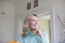 Smiling, ambitious mature woman looking away — Stock Photo