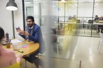Creative businessman brainstorming in meeting — Stock Photo