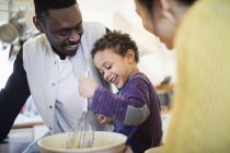 Happy father and son baking in kitchen — Stock Photo