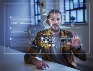 Businessman using futuristic hologram computer — Stock Photo