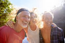 Portrait happy father with adult daughter and sun — Stock Photo