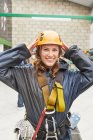 Portrait smiling young woman preparing to zip line — Stock Photo