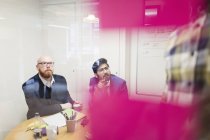 Creative businessmen listening in conference room meeting — Stock Photo