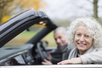 Portrait smiling senior couple in convertible — Stock Photo