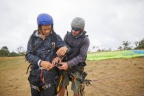 Paragliders preparing equipment outdoors — Stock Photo