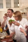 Chef smelling fresh basil in cooking class — Stock Photo