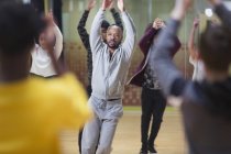 Focused male instructor leading dance class in studio — Stock Photo