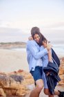 Affectionate couple hugging at beach — Stock Photo