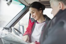 Couple looking at map in motor home — Stock Photo