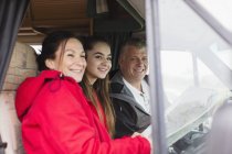 Portrait happy family with map in motor home — Stock Photo