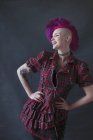 Portrait confident young woman with pink mohawk — Stock Photo
